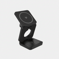 A black magnetic wireless charging stand with a fold-out design, featuring a top square panel with a wireless charging symbol and a bottom base with a charging contact icon, shown on a plain white background.