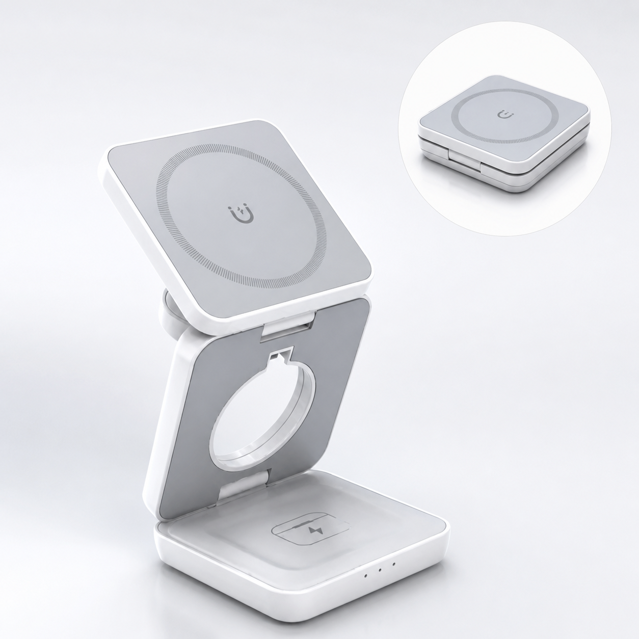 A white and gray foldable wireless charging stand with a square magnetic charging pad on top, shown open with a small inset circle displaying the product closed.
